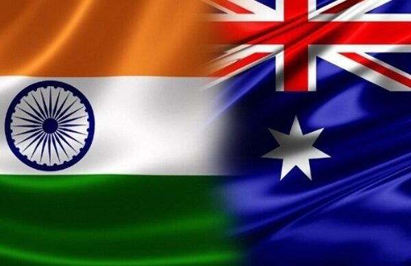 Why do Australians and American citizens visit India?